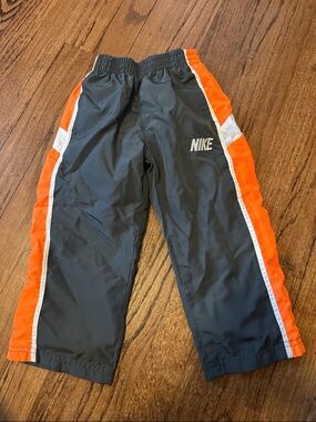 Nike Gray Track Pants with Orange and White Side Stripes